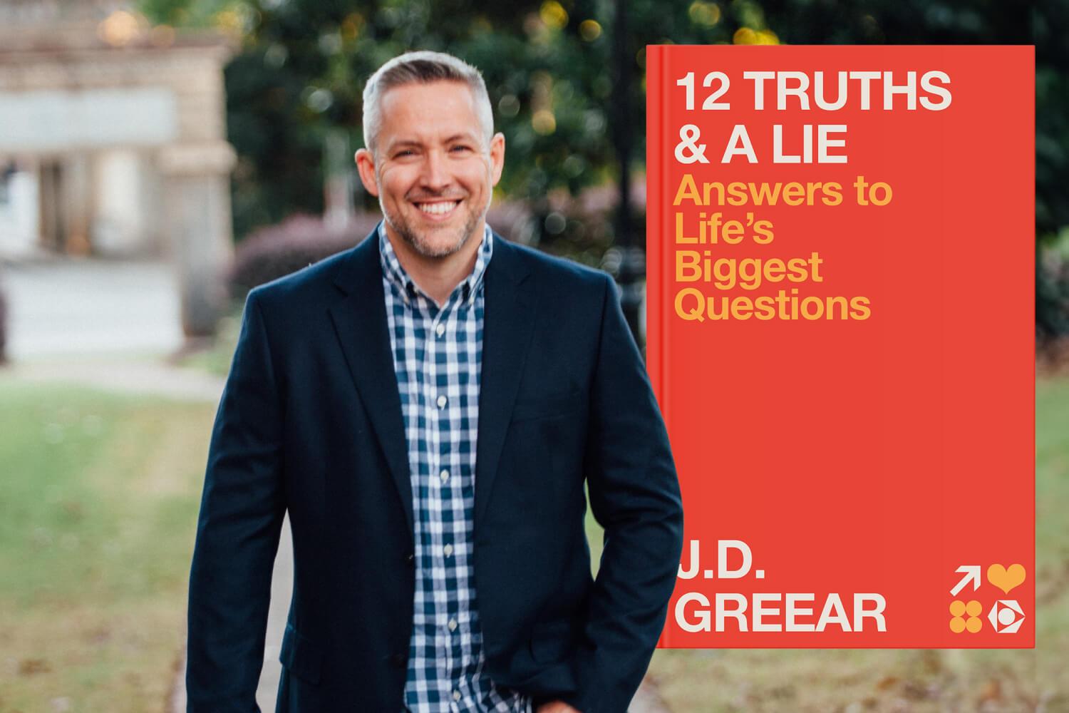 J D Greear smiling in near a field