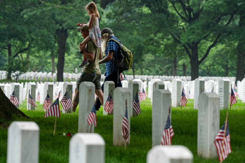 Families visit Section 60 of Arlington National Cemetery, in Arlington, Va., in honor of Memorial Day