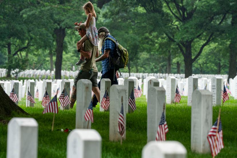 Families visit Section 60 of Arlington National Cemetery, in Arlington, Va., in honor of Memorial Day