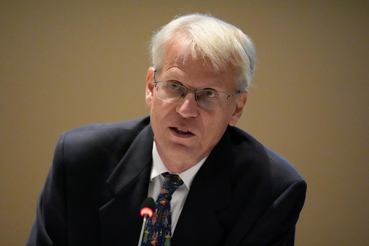 Man speaking in front of microphone