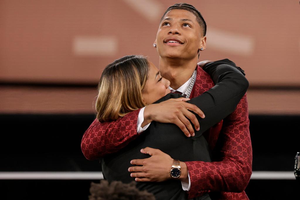 Jeremiah Fears celebrates with family after being selected seventh by the New Orleans Pelicans in the first round of the NBA basketball draft