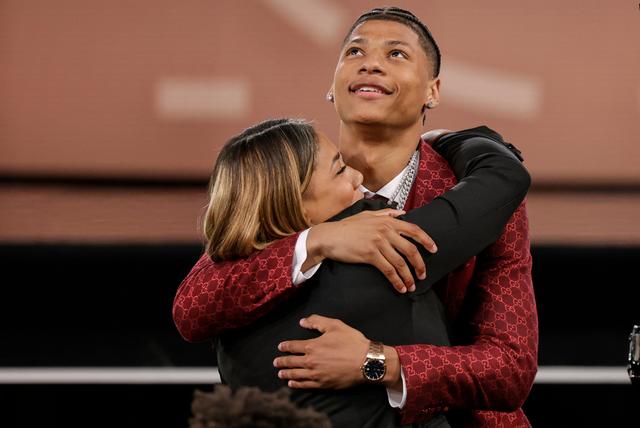 Jeremiah Fears celebrates with family after being selected seventh by the New Orleans Pelicans in the first round of the NBA basketball draft
