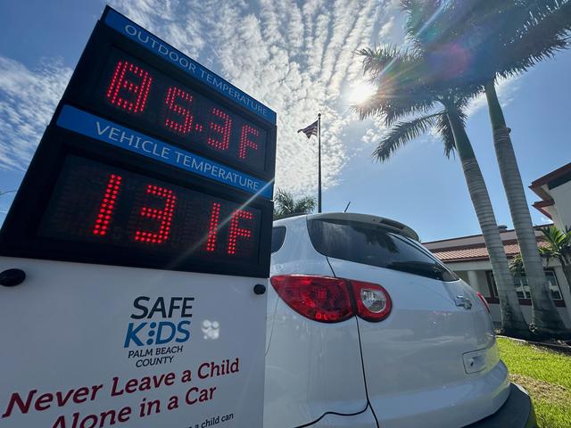 Outside temperature is displayed in comparison to the inside temperature of a vehicle in Belle Glade, Fla. during an event to raise awareness about the dangers of leaving children unattended in vehicles