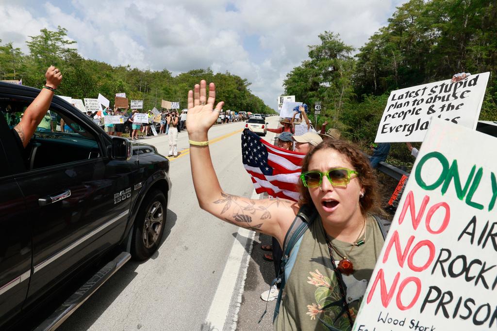 Environmental advocates and protesters at the Dade-Collier Training and Transition Airport on Tamiami Trail