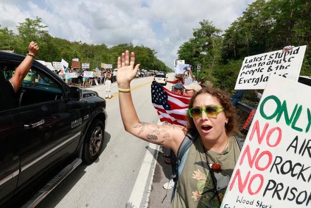 Environmental advocates and protesters at the Dade-Collier Training and Transition Airport on Tamiami Trail