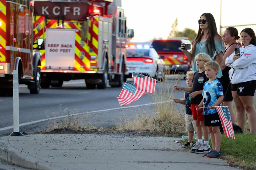 A procession from Kootenai Health heads to the medical examiner's office in Spokane, Wash., after firefighters were killed Sunday,
