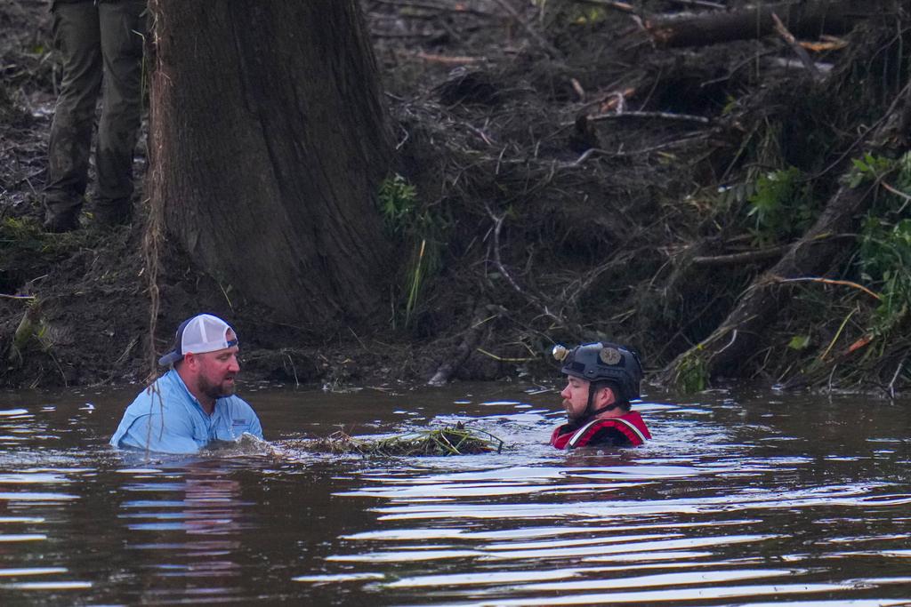 Searchers in the Guadalupe River as they assist in recovery efforts 