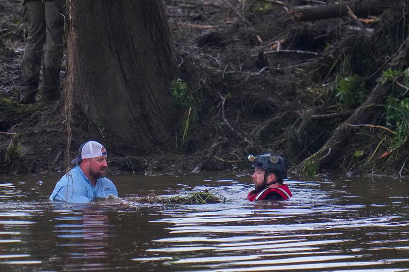 Searchers in the Guadalupe River as they assist in recovery efforts 