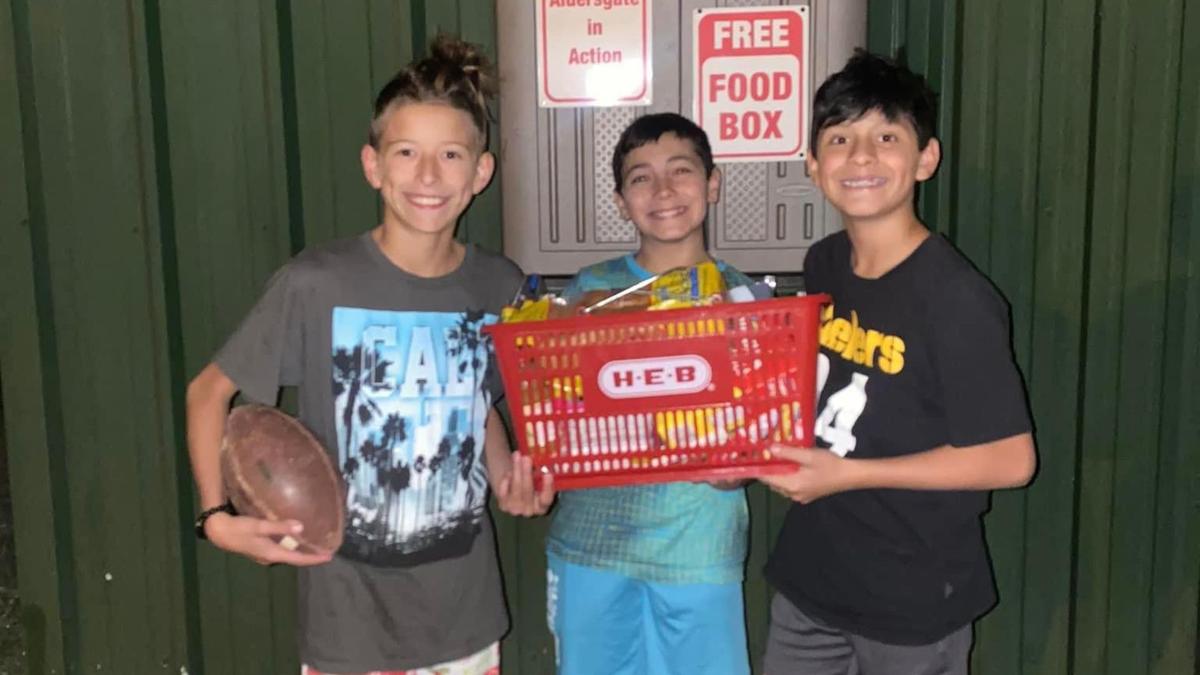 Sebastian Beal and his friends replenishing their local food pantry at Aldersgate Methodist Church. 