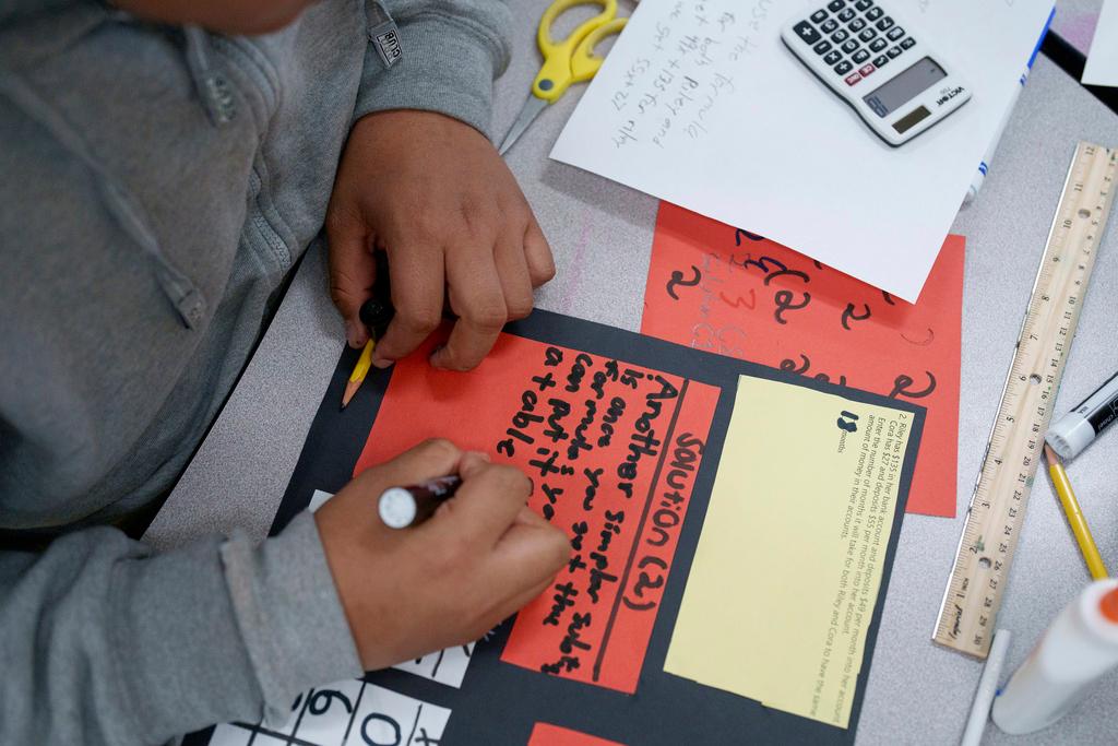 A student works in a classroom at Benjamin O. Davis Middle School in Compton, Calif.,