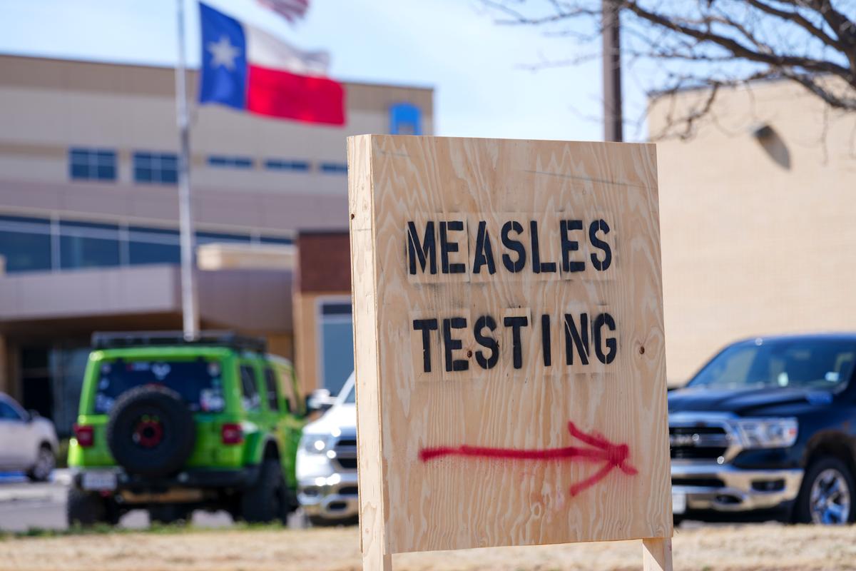 A sign that says "measles testing"