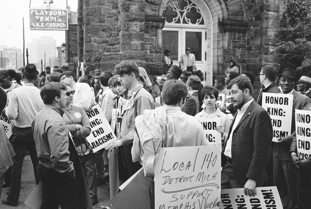 (1968) people gather at the Clayborn Temple as they prepare to march in honor of Dr. Martin Luther King in Memphis, Tenn., four days after the civil rights leader was assassinated. 