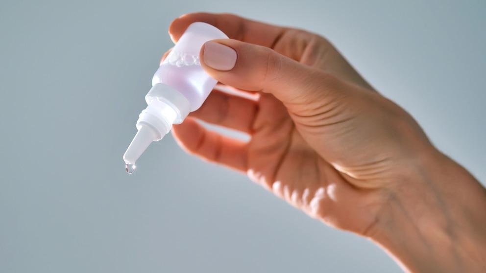 Eyedrops in a woman's hand