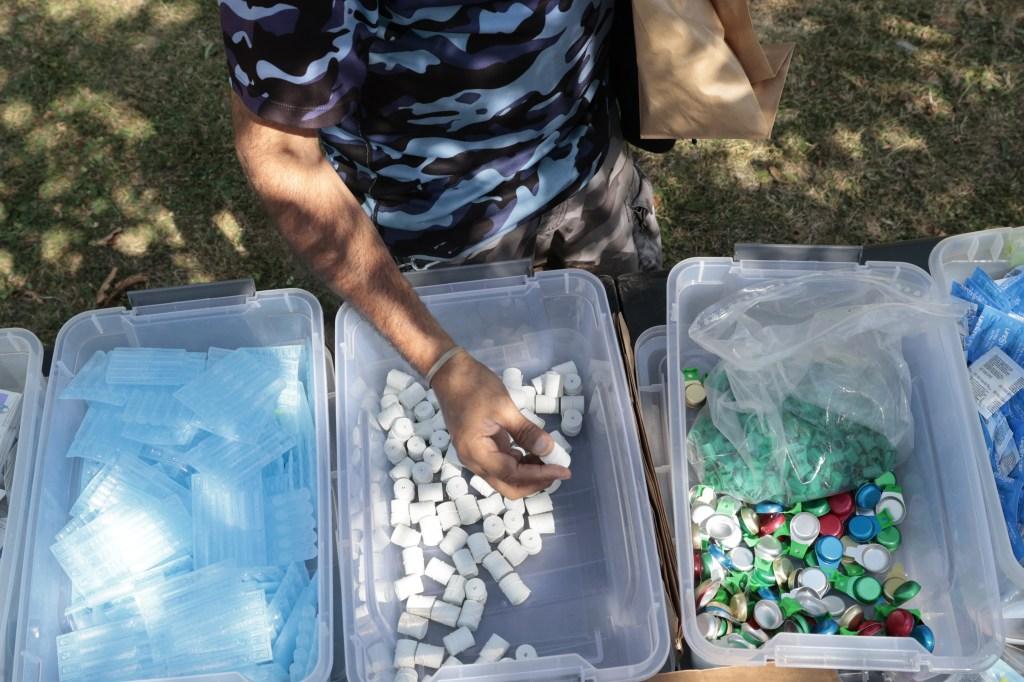 Three plastic bins with different items in them